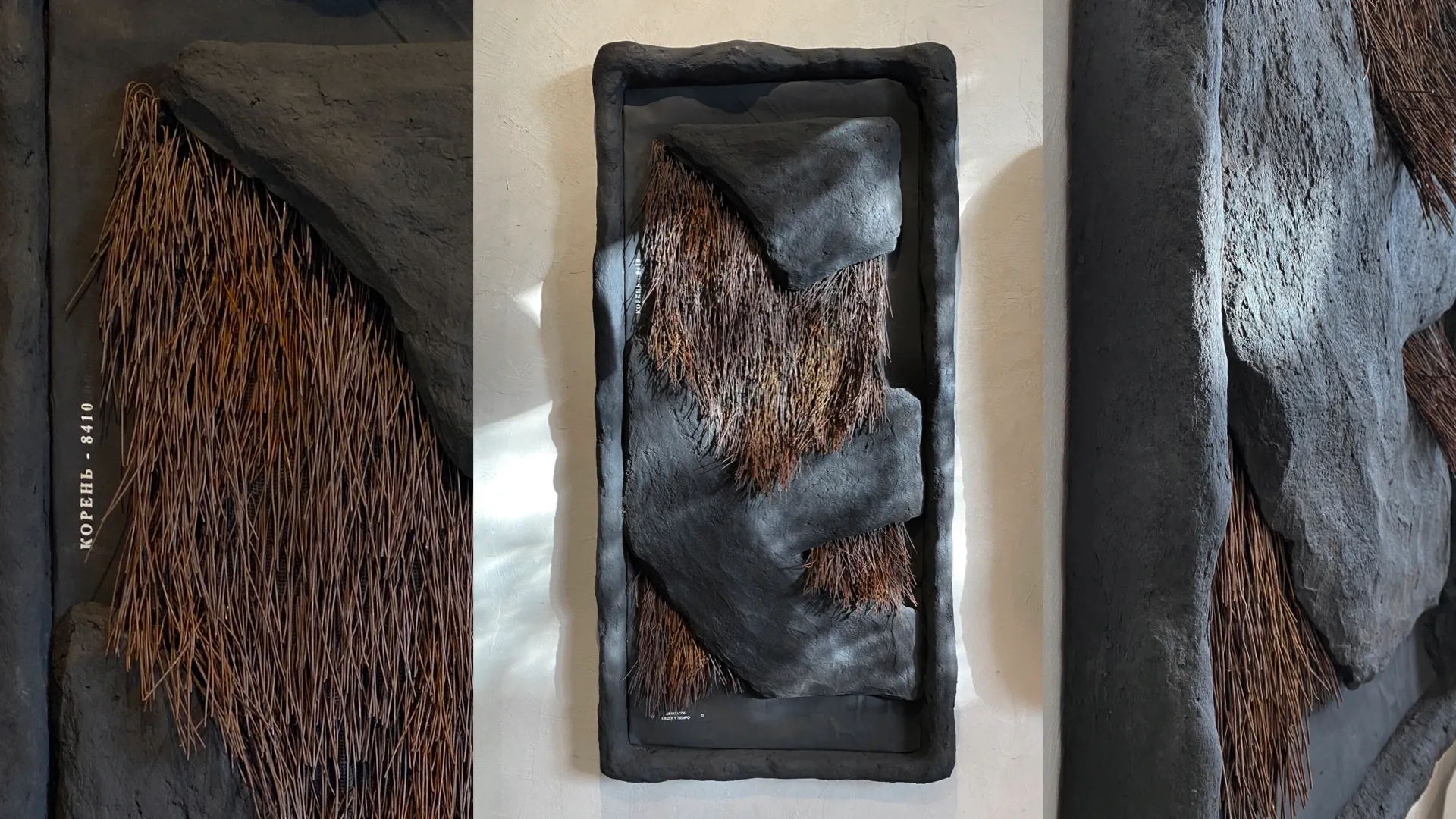 Moldura escura com massa cinza e fibra vegetal ao centro